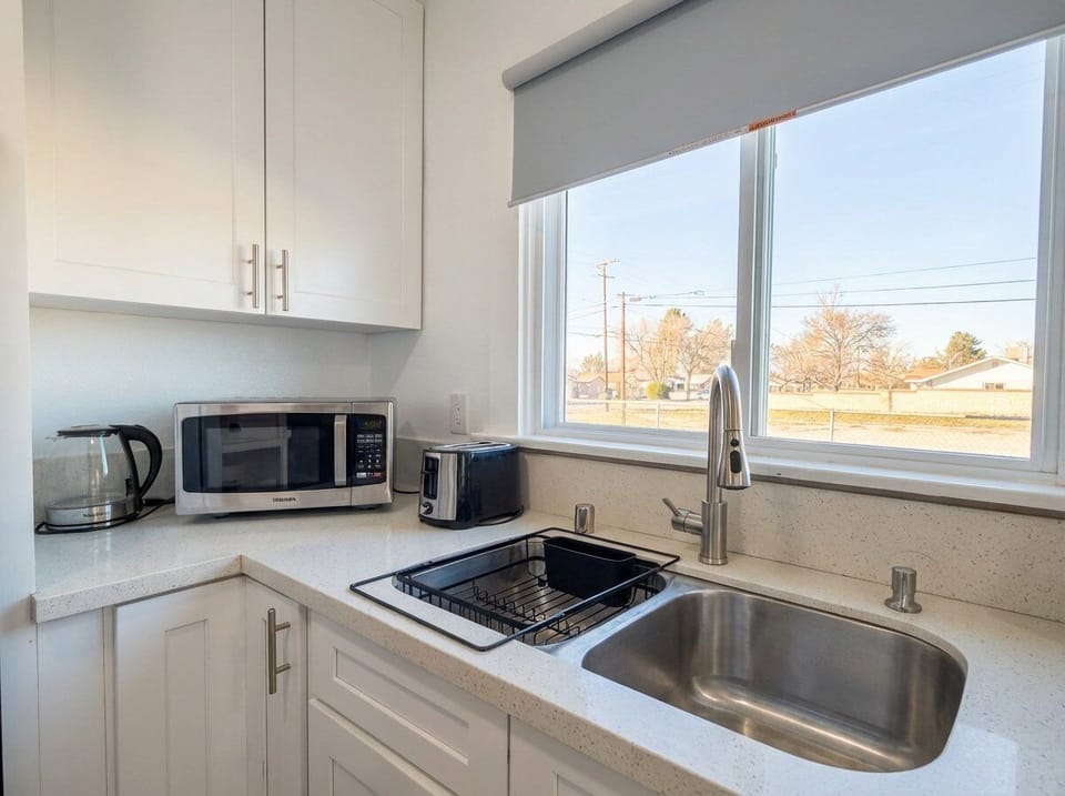 Bright kitchen corner with microwave and coffee station