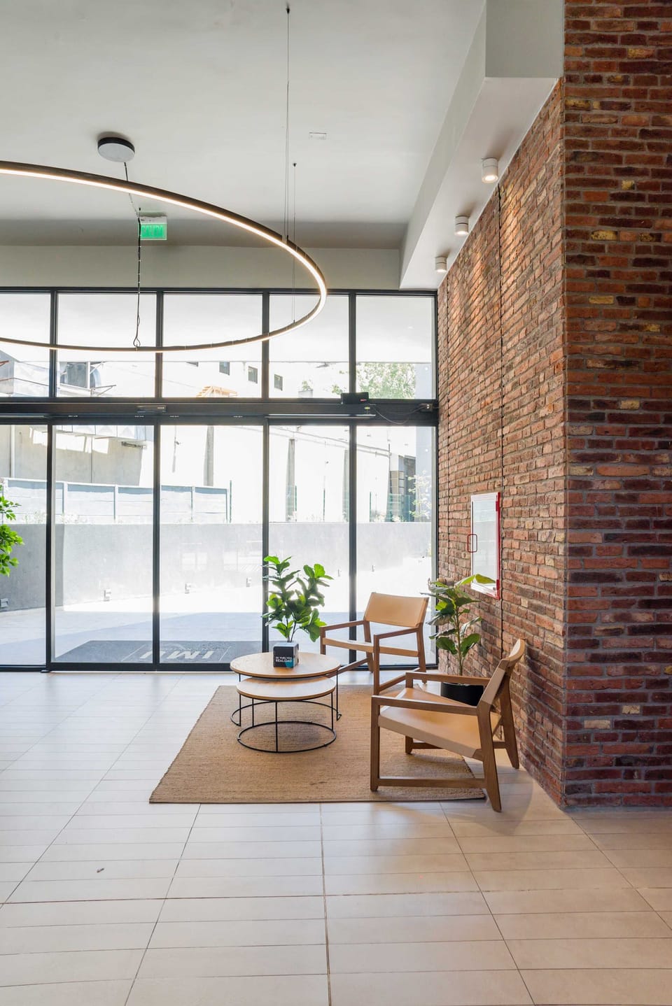 Stylish and inviting lobby with natural light and modern seating, ideal for relaxation or meeting guests. (Common Area)