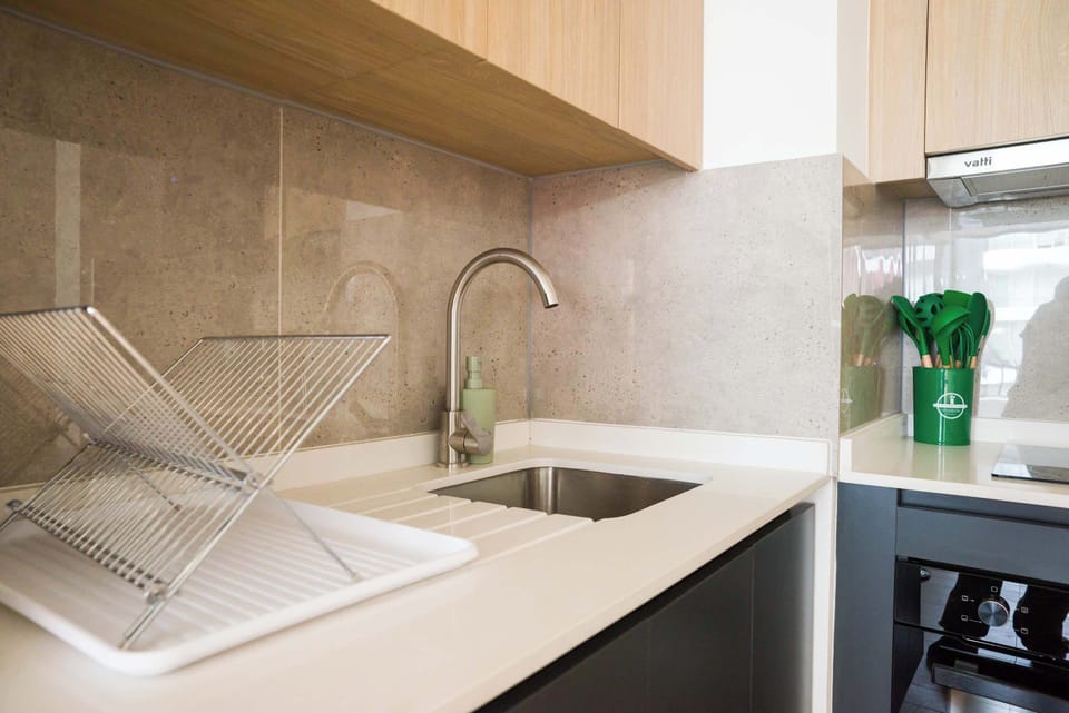Modern kitchen with sleek fixtures and ample workspace, perfect for culinary enthusiasts.