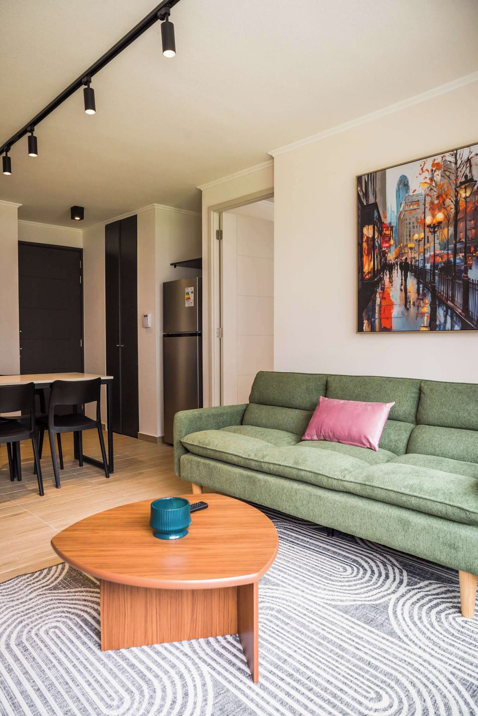 Cozy and stylish living area with modern decor, ideal for relaxation and dining in comfort.