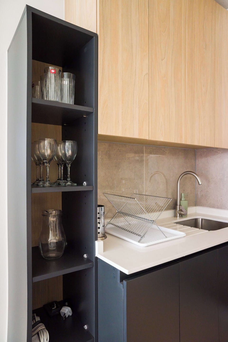 Sleek kitchen with modern cabinetry and essential amenities for your culinary adventures.