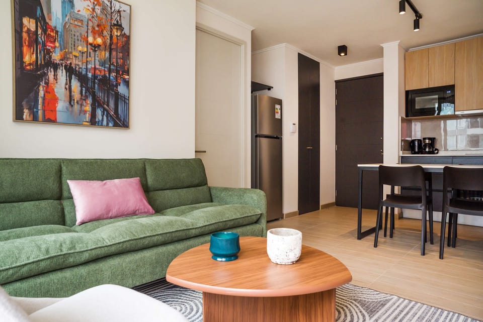Relax in this stylish living area with a modern kitchen, perfect for unwinding after exploring the city.