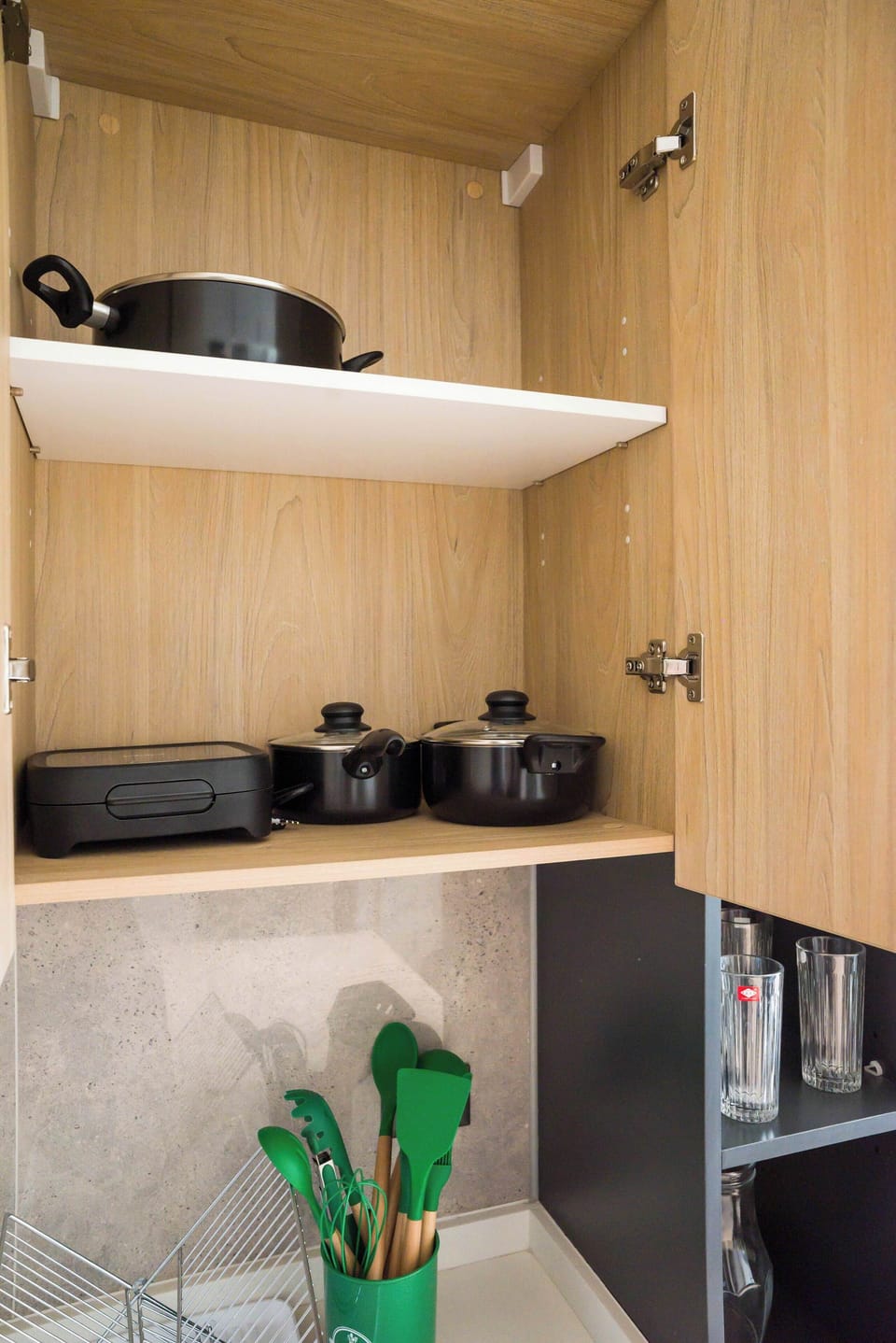 Well-equipped kitchen with modern cookware and utensils for your culinary needs.