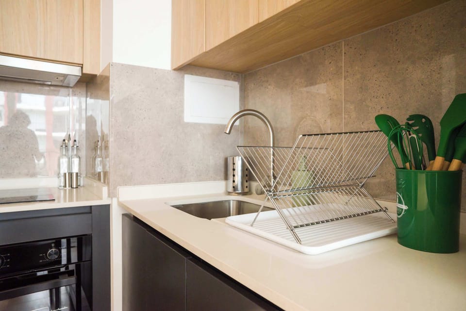Modern and efficient kitchen with sleek appliances and stylish accents, perfect for preparing your favorite meals.