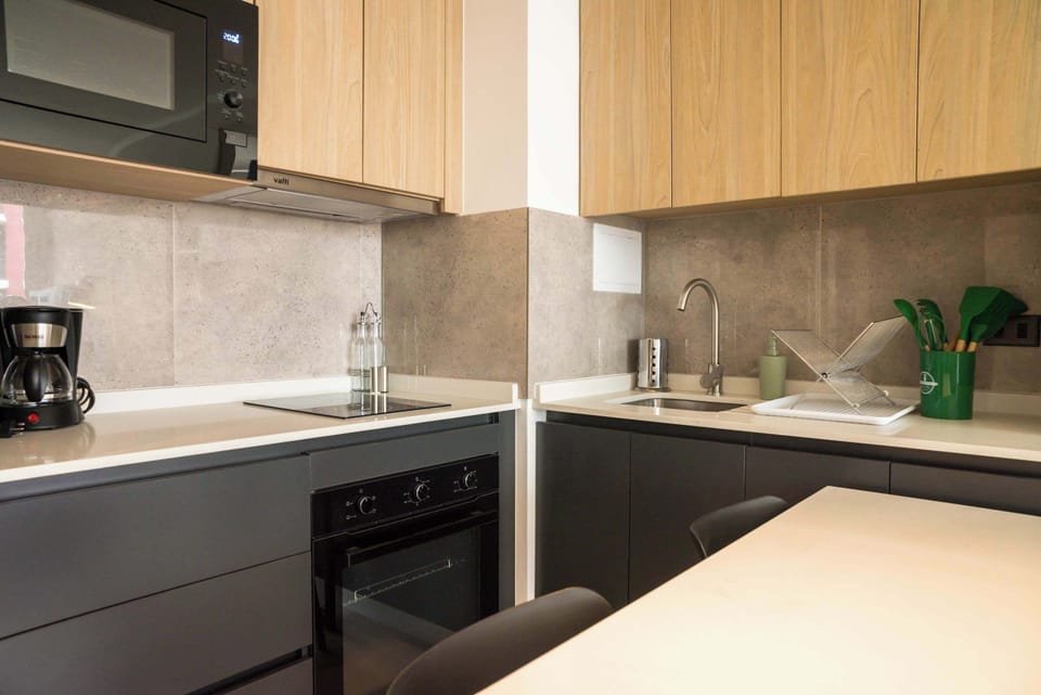Sleek and modern kitchen with all essentials for a comfortable stay.