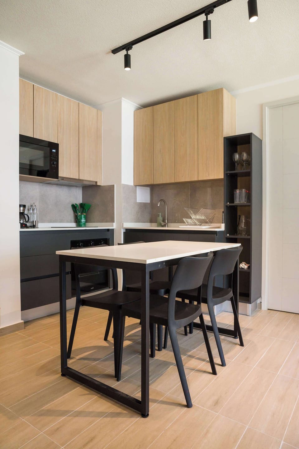 Sleek and modern kitchen with dining space, perfect for enjoying meals in style.
