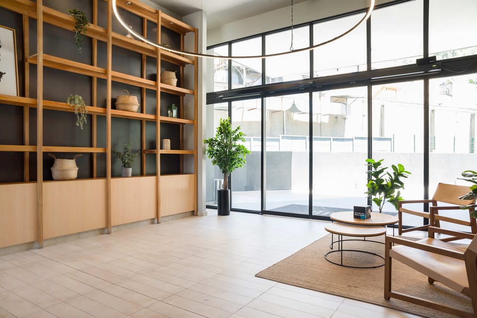 Relax in this bright and airy lounge with stylish decor and ample natural light.
