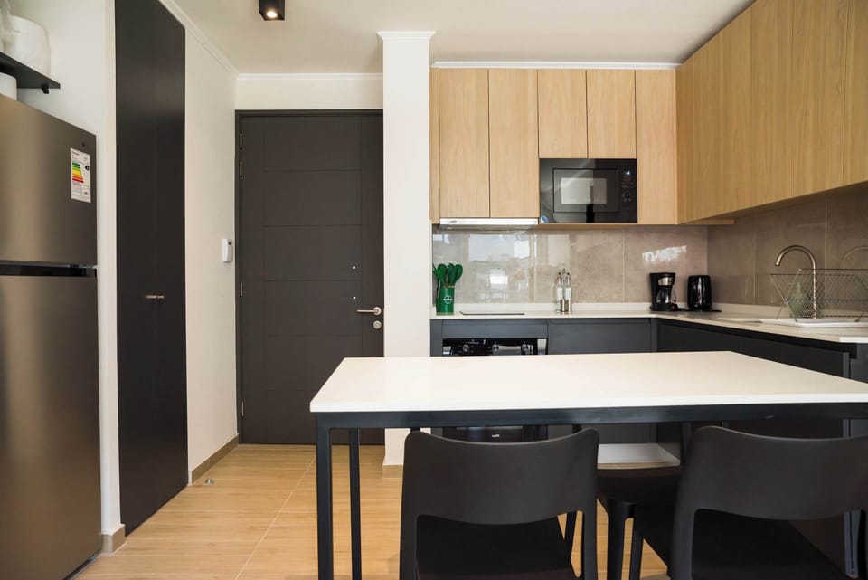 Sleek and modern kitchen with all essentials for a comfortable stay.