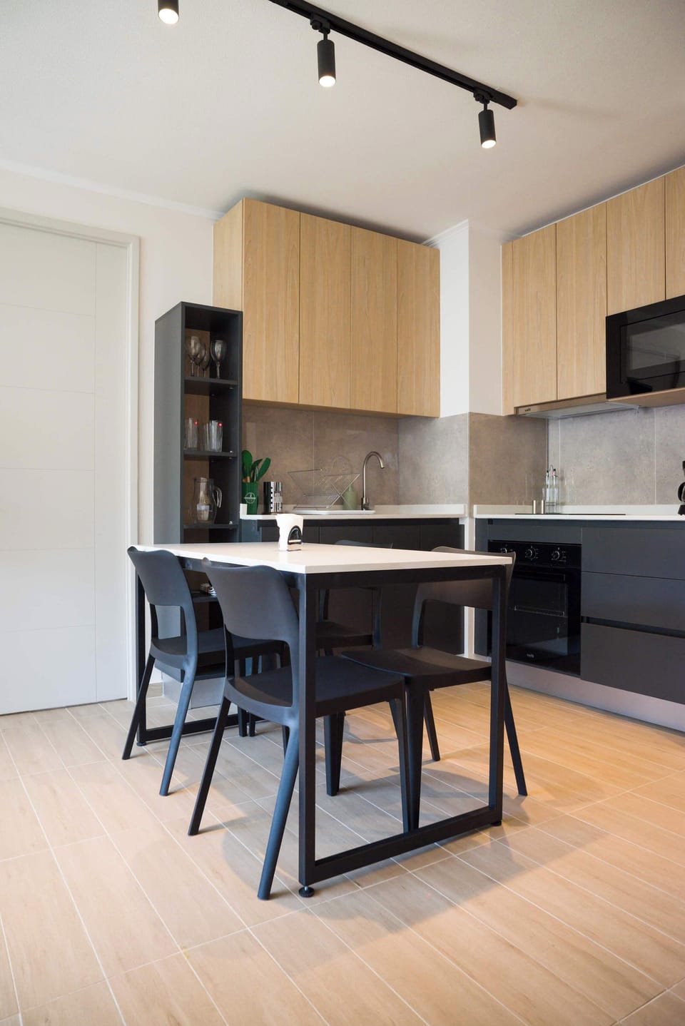 Sleek and modern kitchen with stylish dining area, perfect for enjoying meals during your stay.