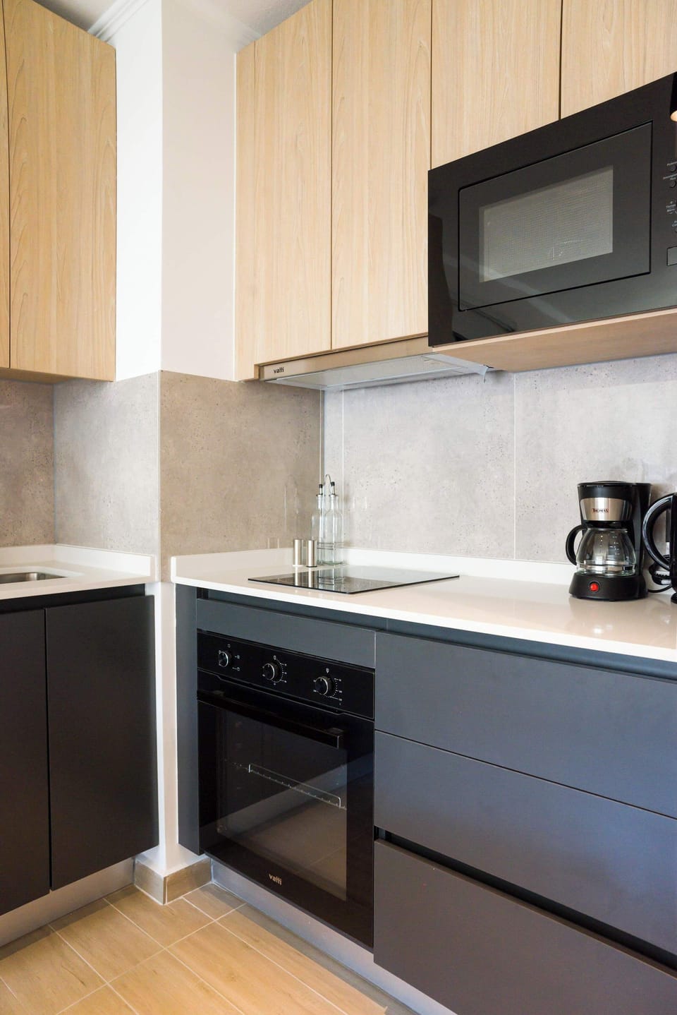 Sleek and modern kitchen equipped with all essentials for a comfortable stay.