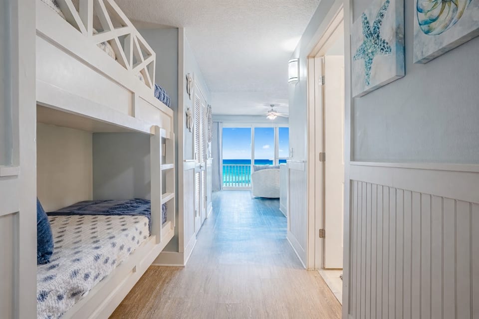 View of the hallway and bunks looking toward the balcony.