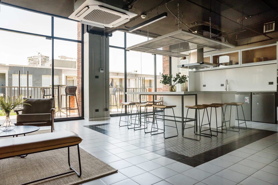 Modern kitchen with stunning city views, ideal for gatherings and culinary adventures.