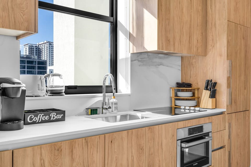 Start your Miami mornings right at our dedicated coffee bar. Equipped with a Keurig, kettle, and fresh supplies, you can enjoy a perfect brew while looking out over the city through the kitchen window