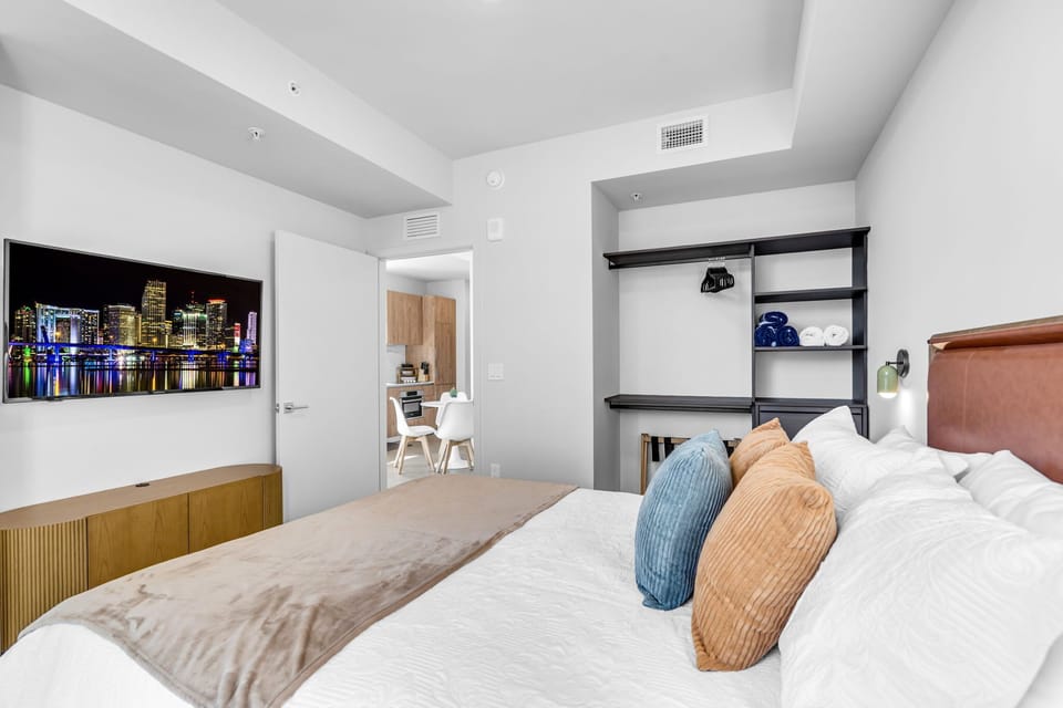 Here are a few options for the bedroom closet area, keeping within the 250-character limit:

Option 1: Functional & Organized "Ample storage for your stay! This bedroom features a large, open-concept closet with built-in shelving and hanging space. 