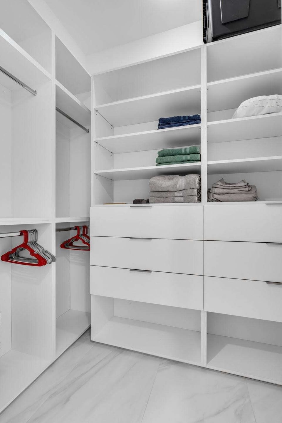 Spacious Walk-In Closet! No need to live out of a suitcase here. The primary suite features a large custom closet with built-in shelves, drawers, and plenty of hanging space so you can unpack and feel right at home.
