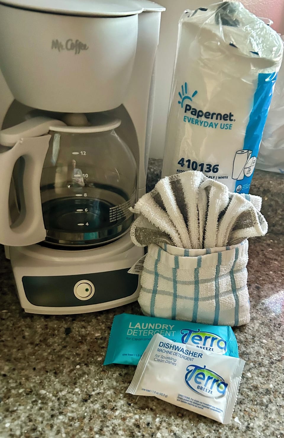 Drip coffee maker & filters, paper towel & detergent for dishwasher provided.