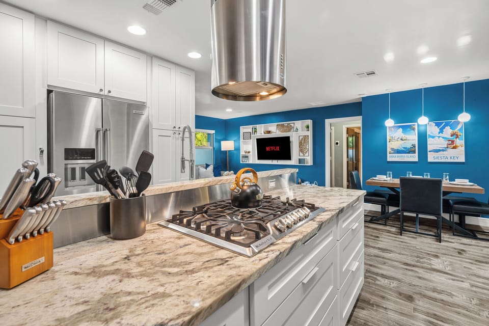 We love the open floor plan that allows everyone to feel connected whether they're relaxing in the living room, eating a snack at the dining table, or cooking in the kitchen!