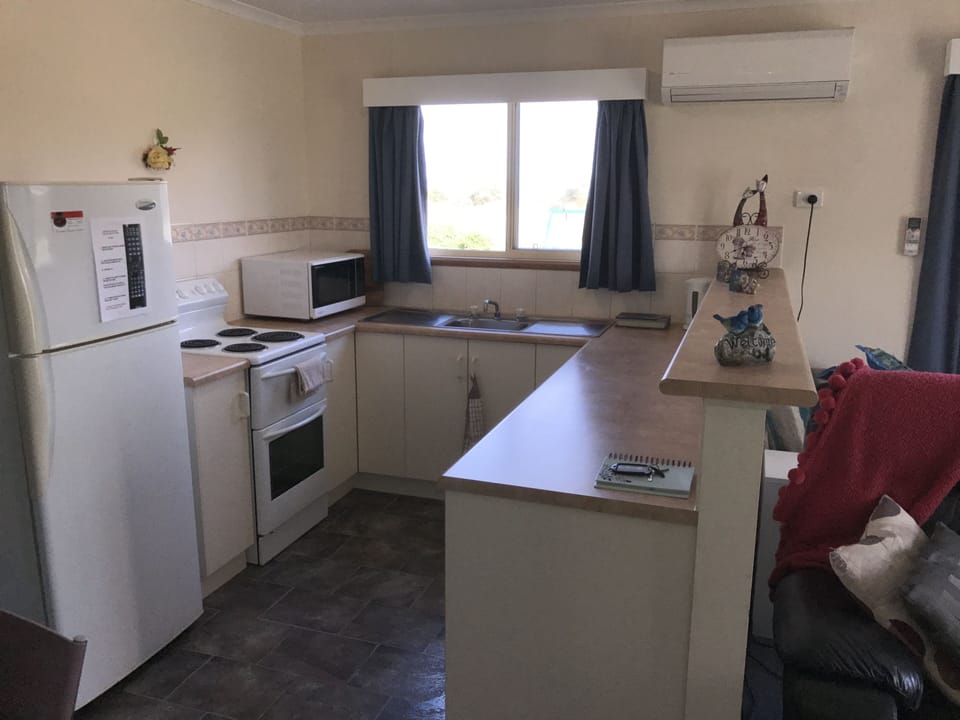 Clarice's Cottage | Private kitchen | Full-size fridge, microwave, stovetop, espresso maker