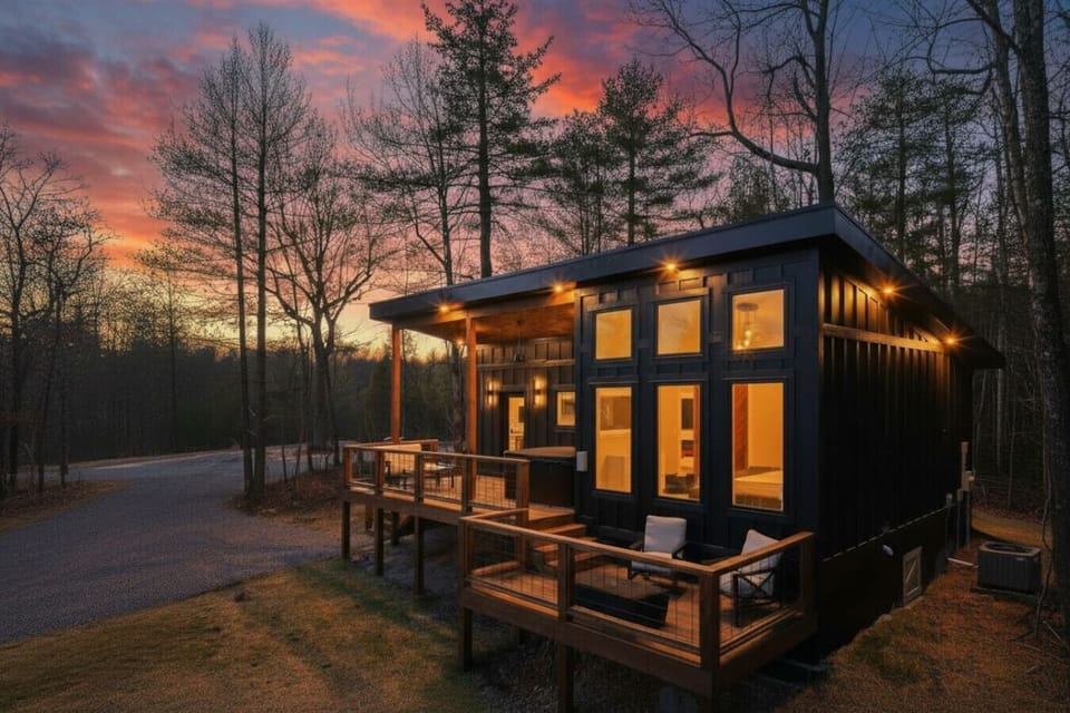 Expansive deck for family gatherings or intimate sunsets – relax with panoramic wooded vistas.