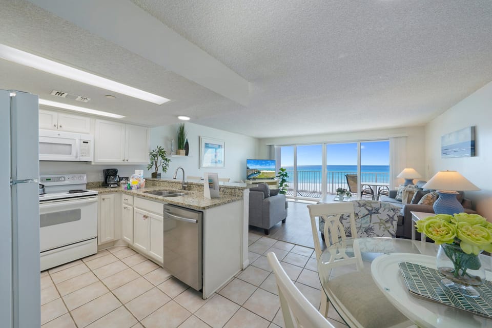 Prepare meals in the fully equipped kitchen while enjoying views of the Emerald Coast from this Gulf-front vacation rental.
