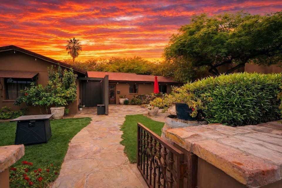 Shared front yard with multiple outdoor dining areas.
