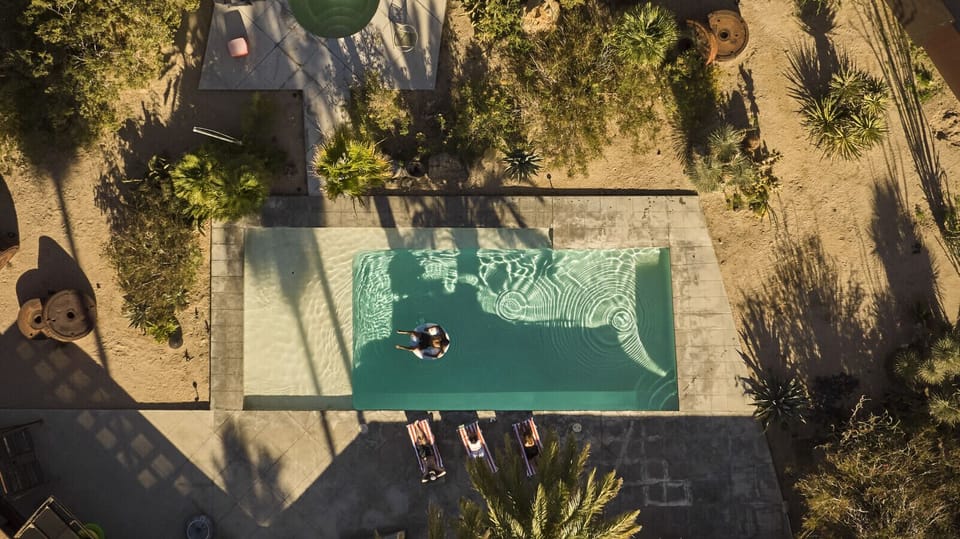 Pool, fire pit, terrace, and native desert landscaping. Every inch designed for living well.