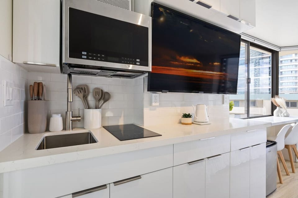 Cook like a pro in this fully equipped kitchen featuring a sleek design, ample storage, and everything you need for a comfortable stay.