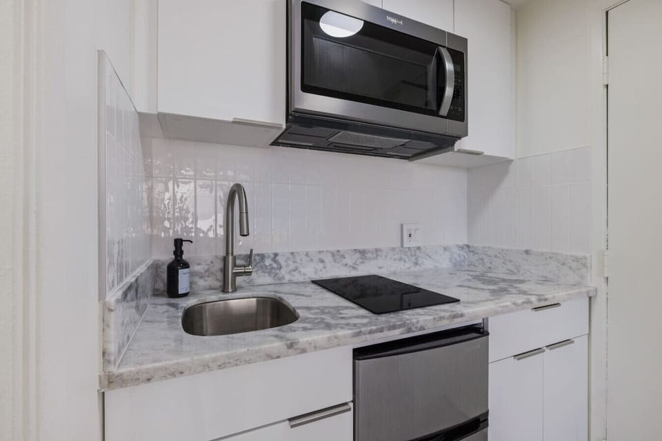 Feel at home with this fully equipped kitchen offering plenty of counter space, cookware, and a stylish, contemporary design