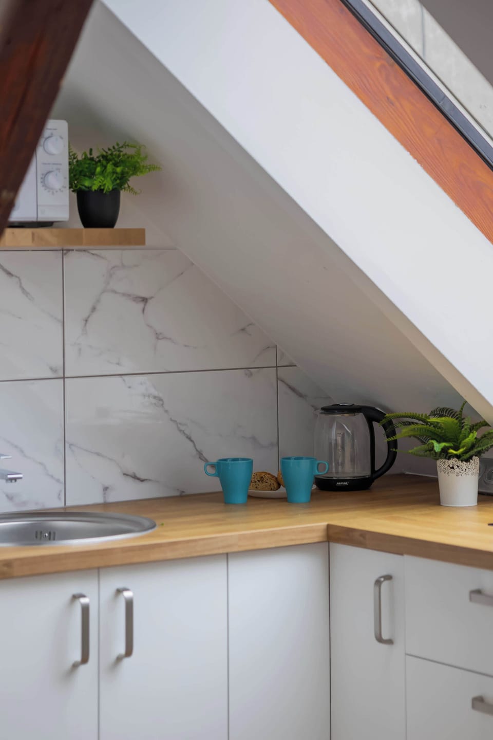 Kitchen corner with cabinets and countertop.