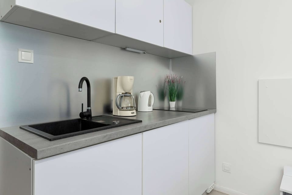The kitchenette's practical layout maximizes space and functionality.