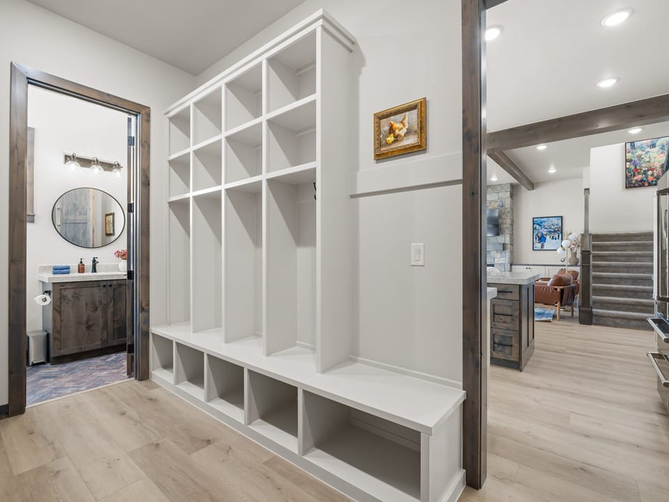 Just off the Garage and Kitchen area is a large mudroom with lots of gear storage, a generous butlers pantry with wine cooler and additional food prep areas as well as full bathroom.