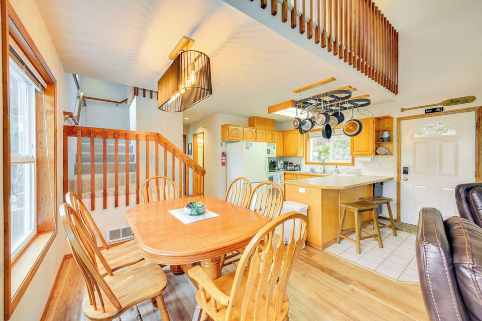 Dining area and kitchen. Table seats 6  with two bar stools at the counter. 