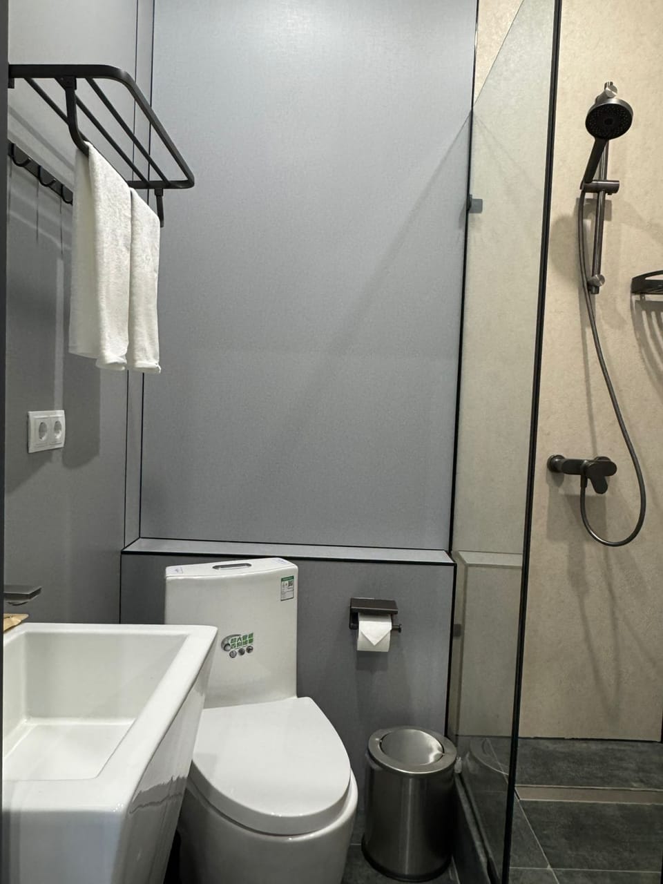 Shower, hair dryer, slippers, towels