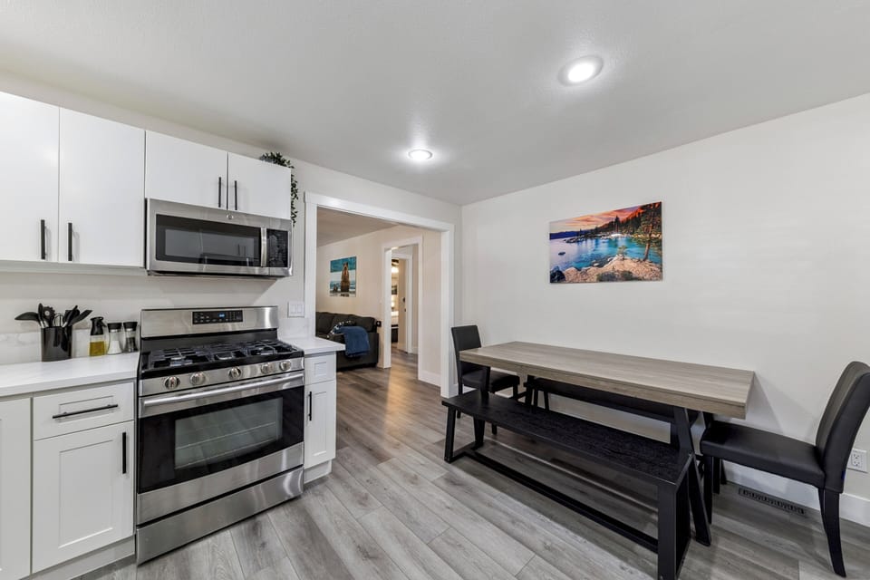 Your modern kitchen features stainless steel appliances and flows into a spacious dining area perfect for memorable meals together.