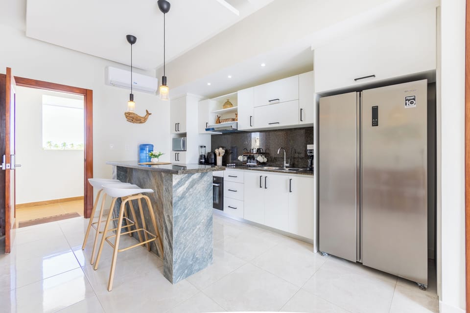 Bright kitchen with breakfast bar.
