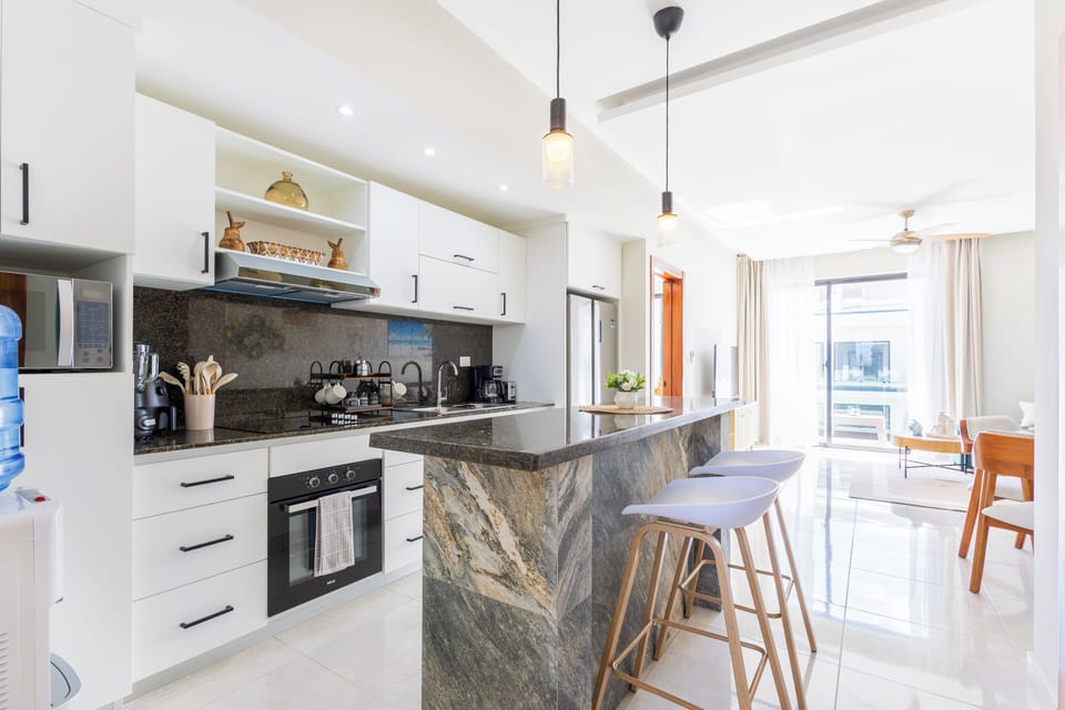 Modern kitchen with bar seating.