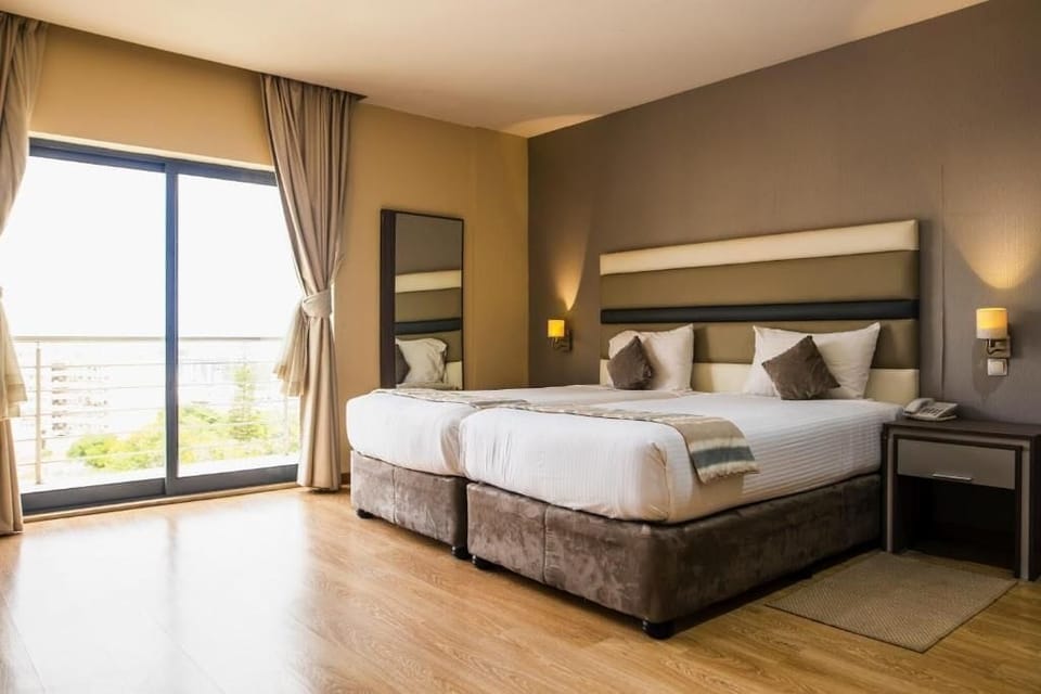 Deluxe Twin Room, Balcony, City View | In-room safe, desk, laptop workspace, soundproofing