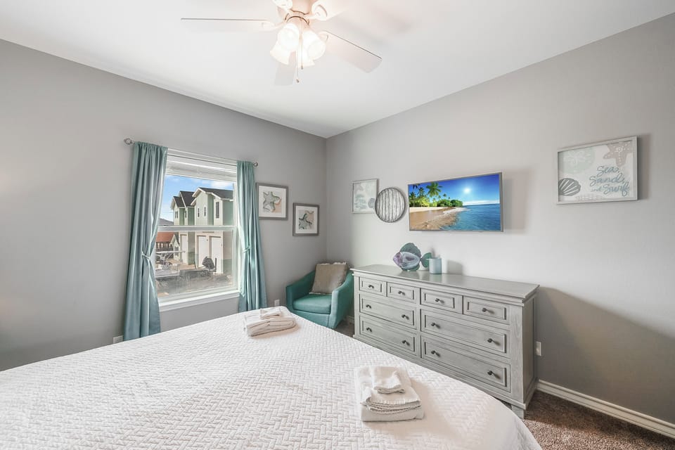 Unwind in your peaceful bedroom with coastal charm, featuring comfortable bedding, ample storage, and soothing ocean-themed decor to help you relax after each adventure.