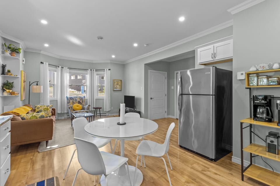 Gather around for breakfast, dinner, or a glass of wine in this cozy dining space filled with natural light.