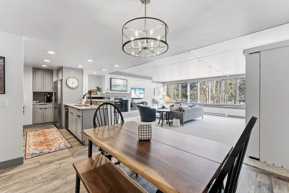 Relax in your spacious open-concept living area where modern kitchen flows into comfortable dining and lounge spaces with stunning natural light.