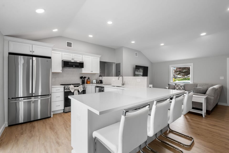 The kitchen counter seats up to four people.