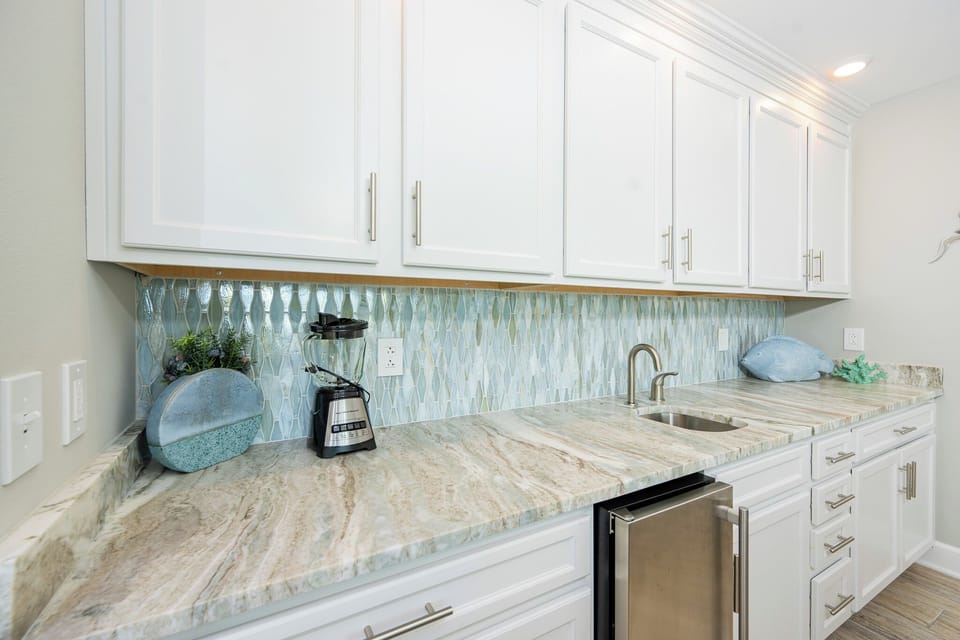 Grab a chilled drink from the fridge or create your favorite cocktail at the wet bar