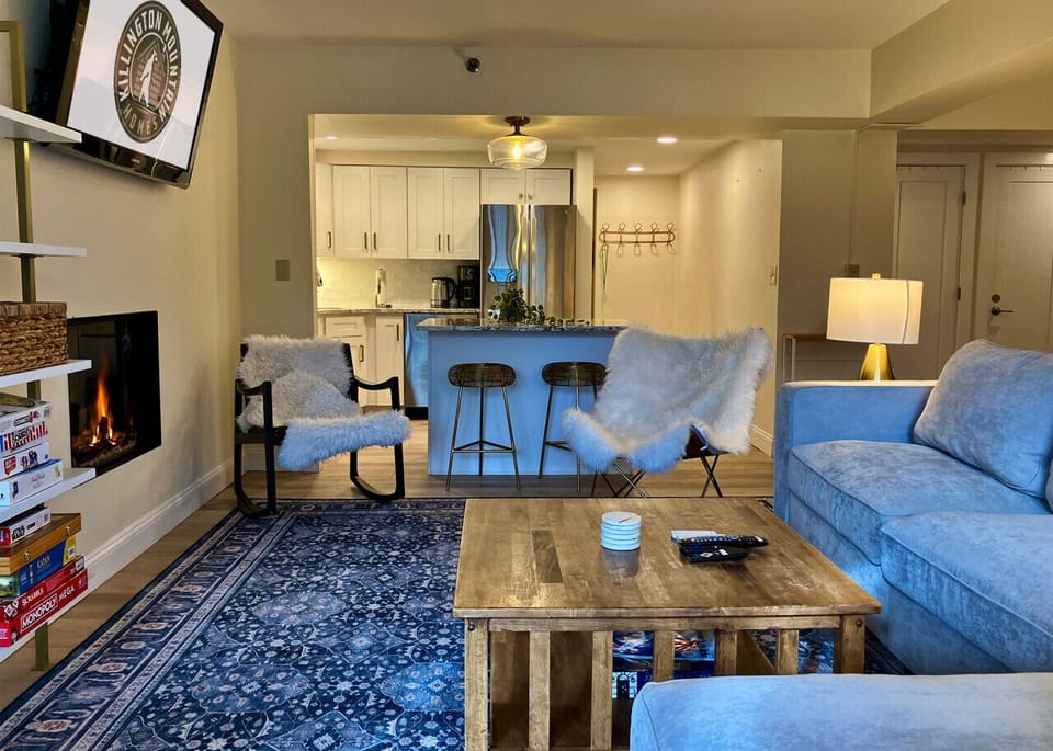 Relax by the fire in our cozy, open-concept living space.