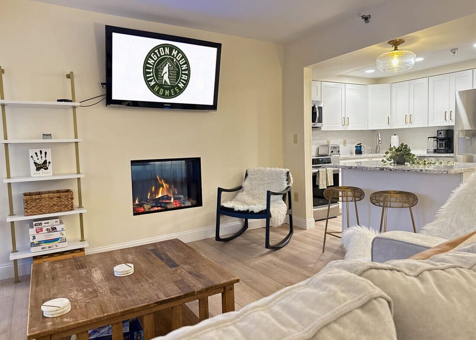 Warm up with your favorite shows in front of the modern fireplace.