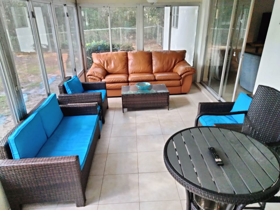 Florida room with tv.