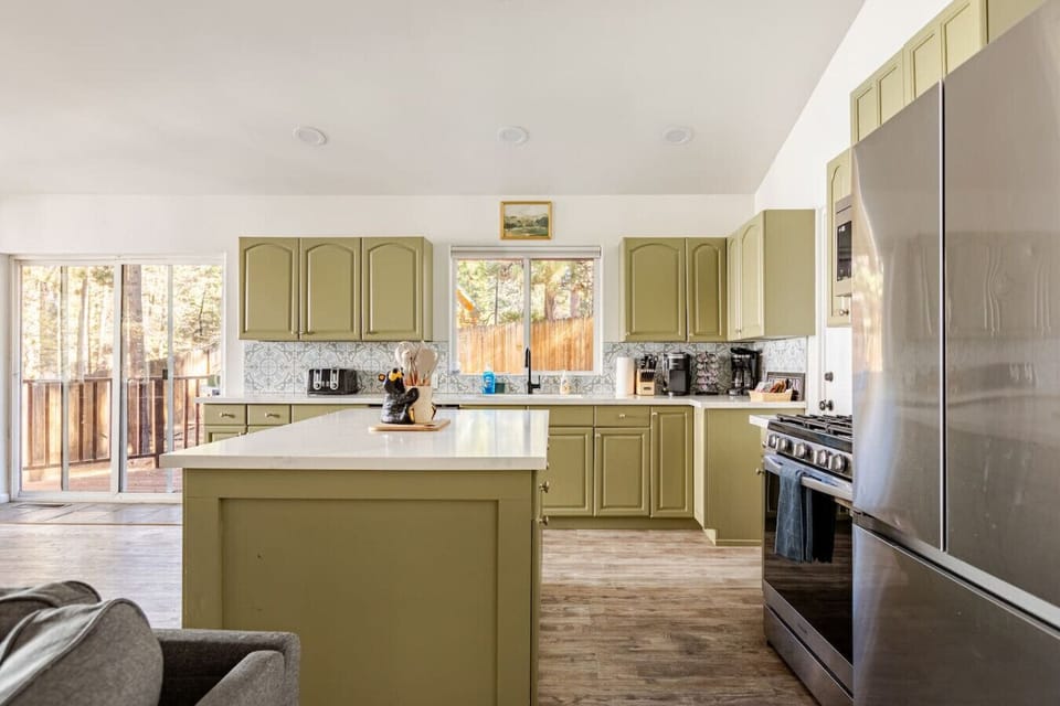 Main level. Here you will find a large room great for families and groups. A large sofa, dining area, and a newly renovated kitchen. There is also a half bath on this level for your convenience. The washer and dryer in the laundry room are on this level.