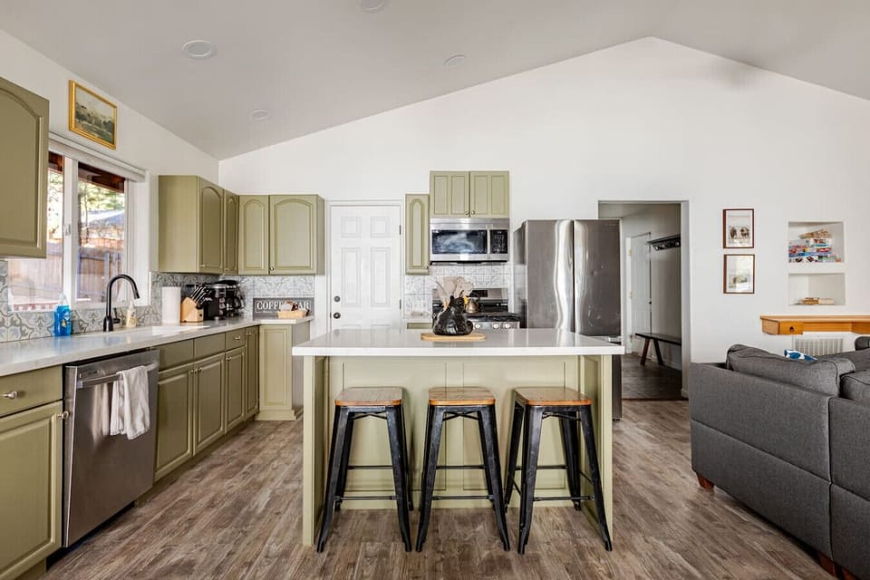 Main level. Here you will find a large room great for families and groups. A large sofa, dining area, and a newly renovated kitchen. There is also a half bath on this level for your convenience. The washer and dryer in the laundry room are on this level.