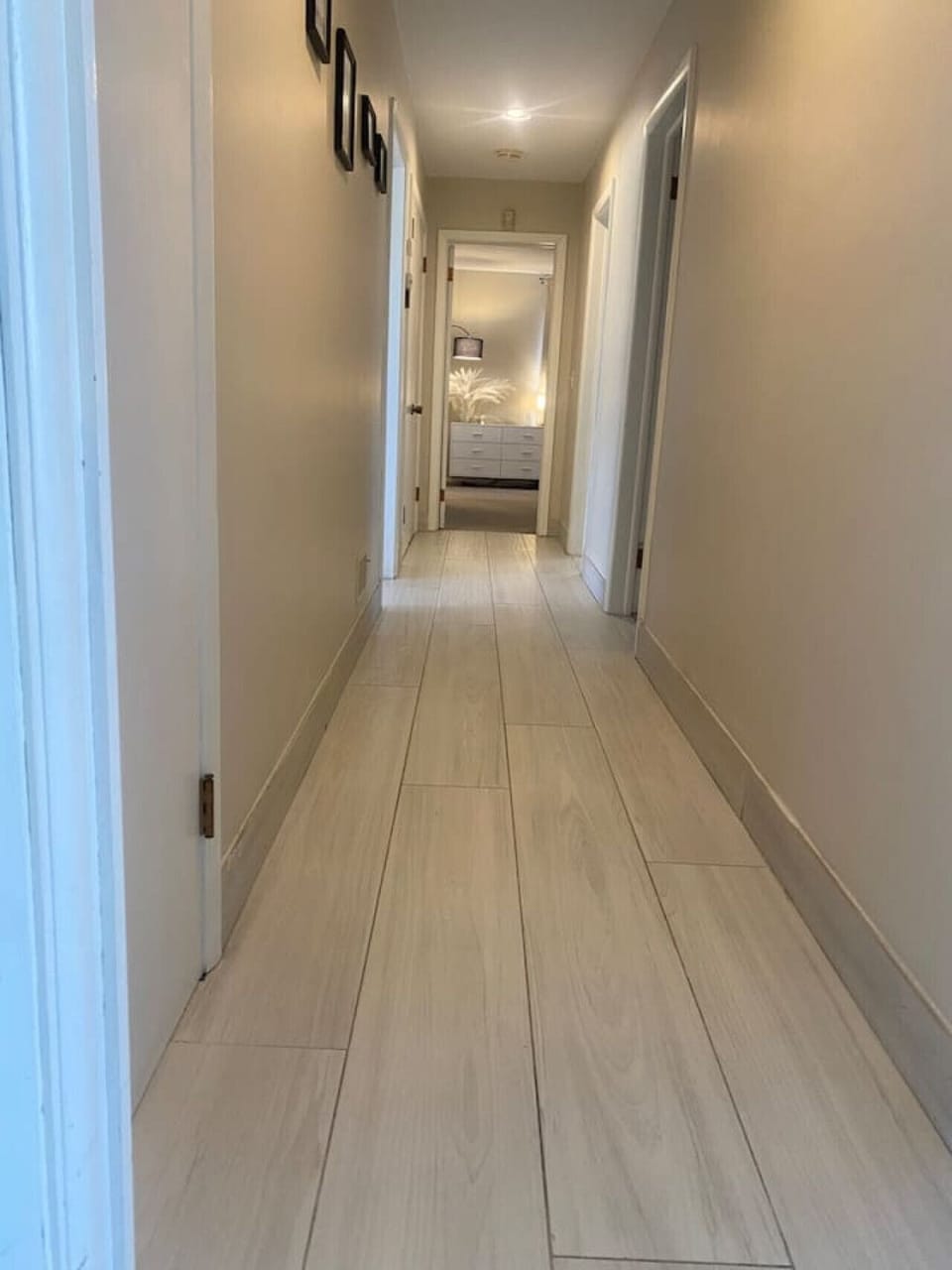 Bright hallway with light hardwood flooring