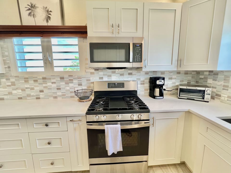 GE microwave and gas stove.