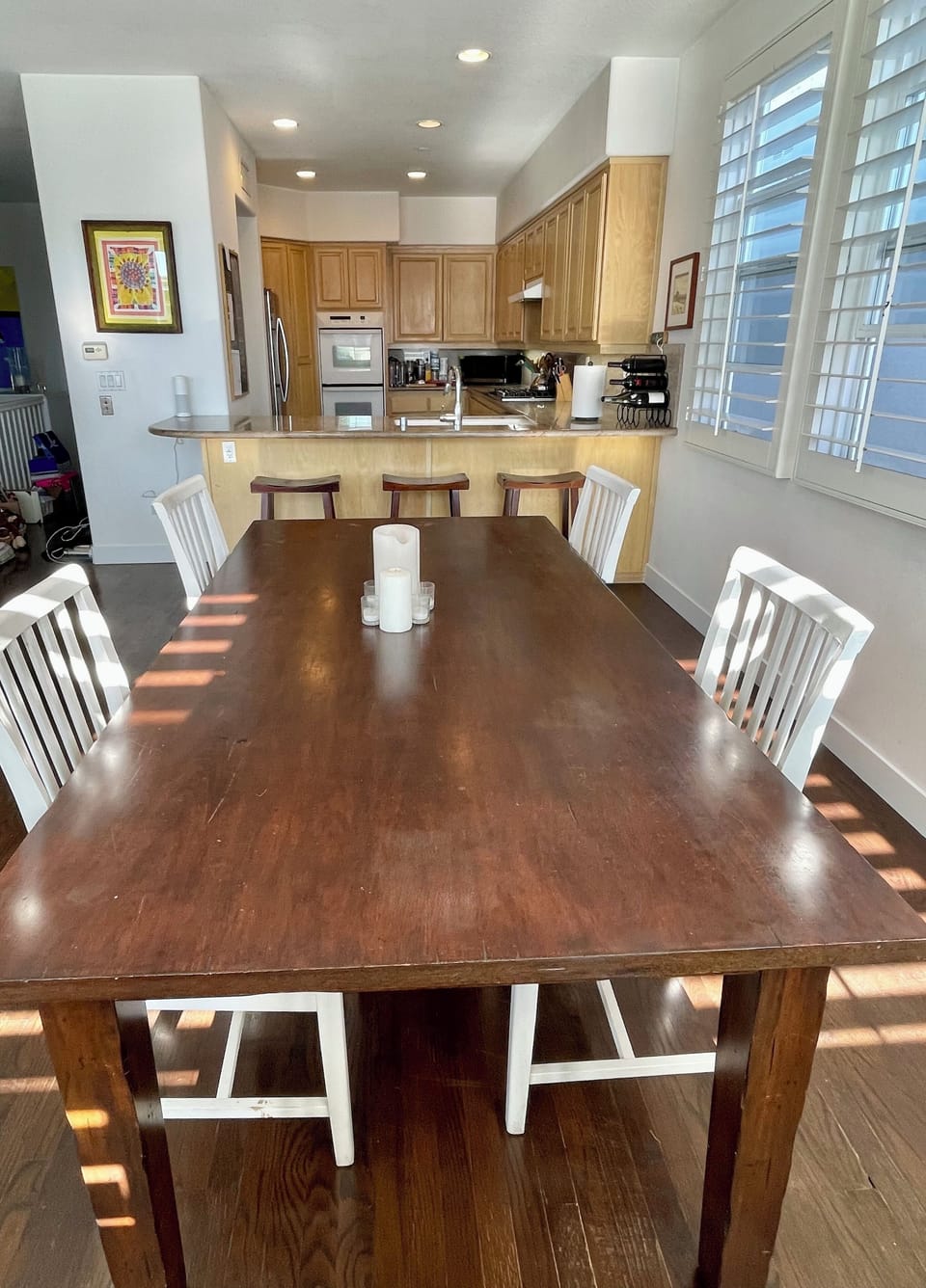 Dining area adjacent to the kitchen and living room with open layout.